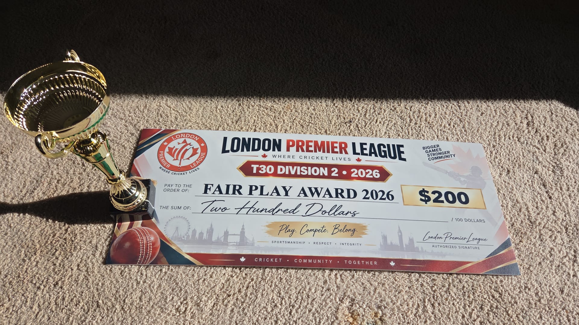 The London Premier League T30 Division 2 Fair Play Award 2026 trophy, beside a presentation cheque for two hundred dollars